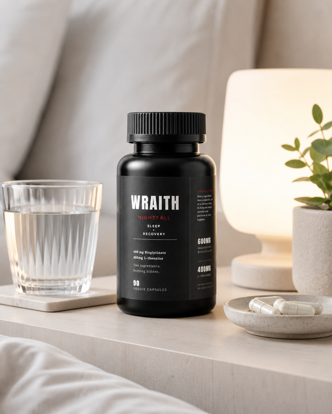 Nightfall bottle on a calm bedside scene with water, capsules, and warm evening light.